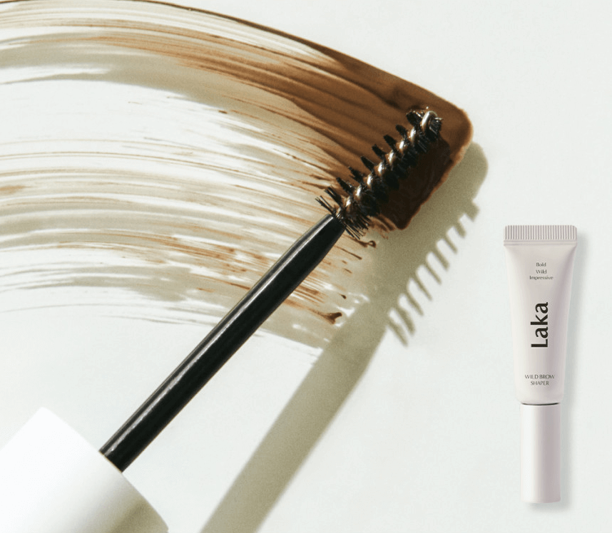 Laka Wild Brow Shaper with applicator brush and brown tint swatch for defined, well-groomed brows.