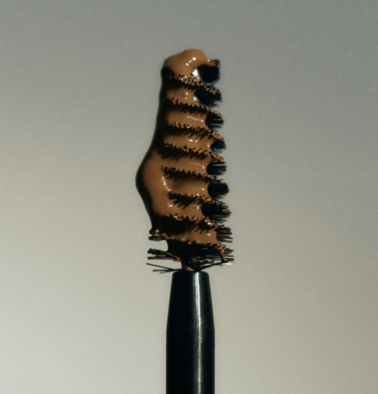 Laka Wild Brow Shaper brush coated with brown gel for defined and tamed eyebrows.