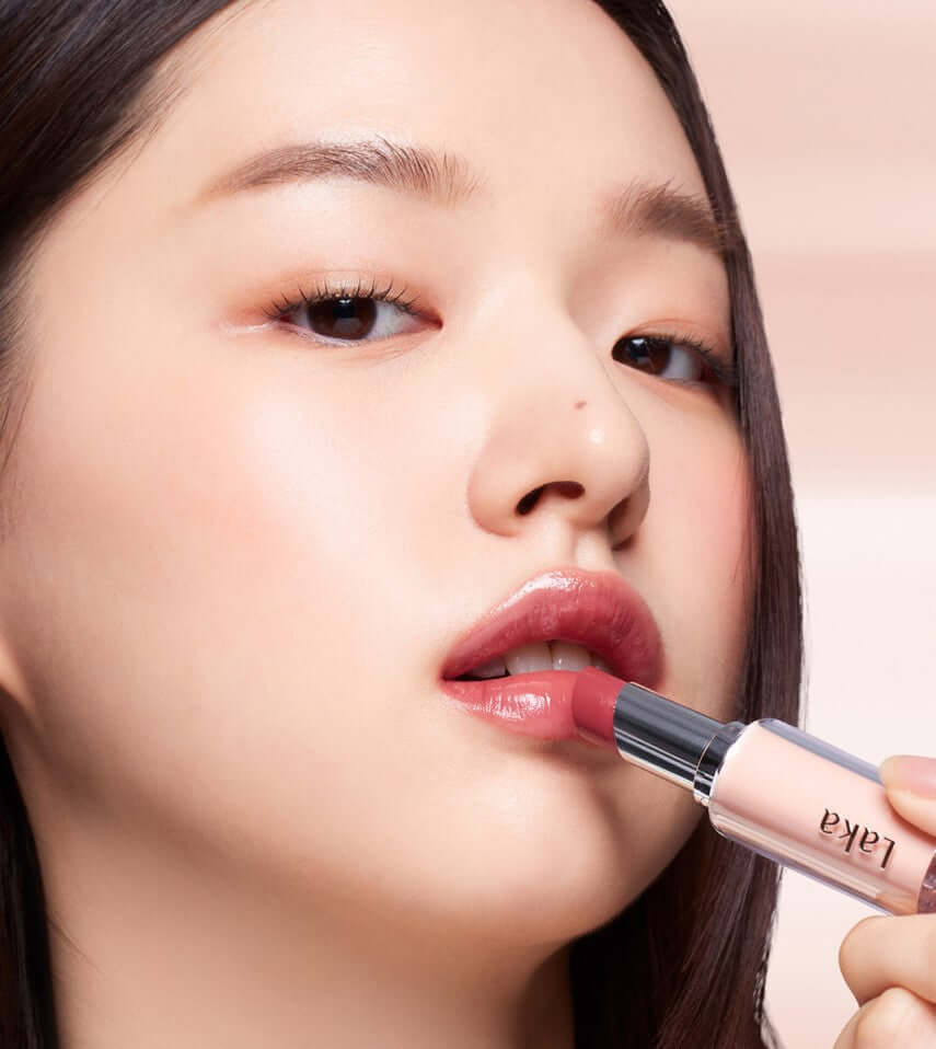 Laka Bonding Glow Lipstick applied on lips, showcasing instant glow and luxurious color range.