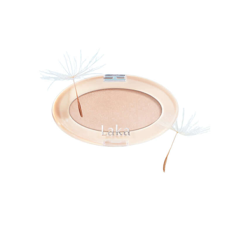 Laka Dreambeam Highlighter powder in a compact, showcasing a radiant glow and vegan ingredients for luminous skin.