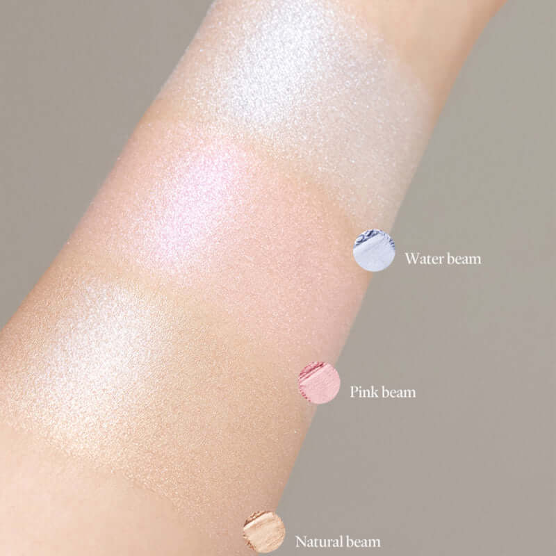 Swatches of Laka Dreambeam Highlighter in Water Beam, Pink Beam, and Natural Beam on skin.