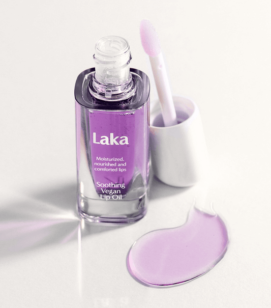 Laka Soothing Vegan Lip Oil in Calming Purple bottle with applicator, nourishing and moisturizing formula for healthy lips.