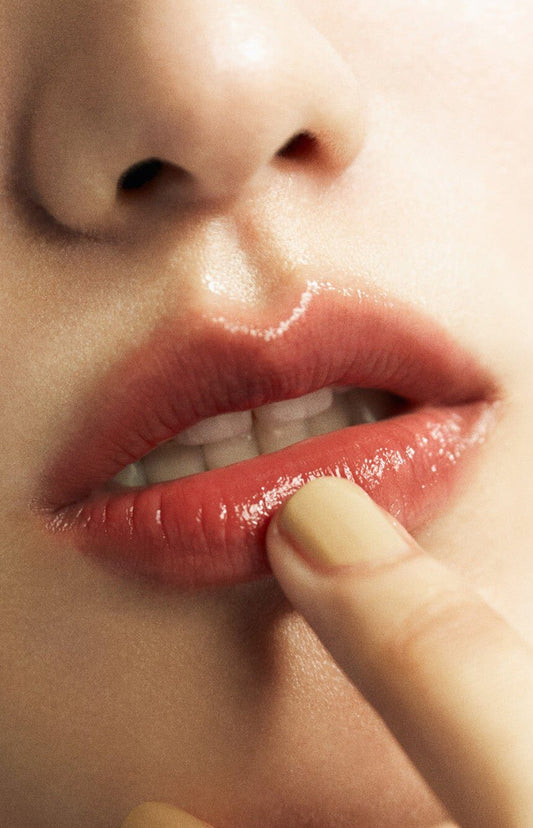 Close-up of lips wearing tinted Laka Soul Vegan Lip Balm, showcasing a glossy finish and natural sheen.