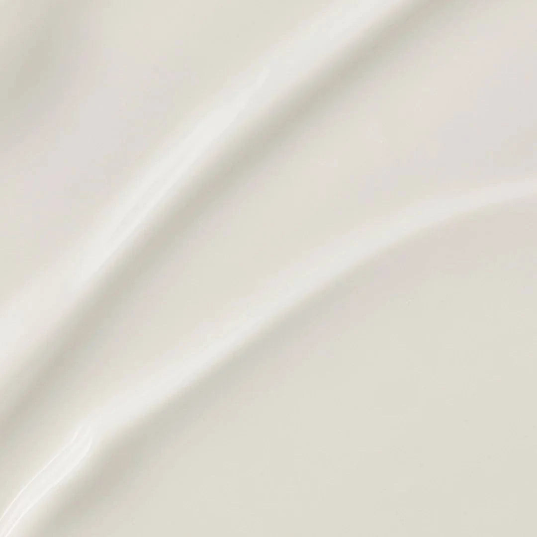 Close-up of smooth, glossy cream surface, ideal for showcasing beauty products that offer rich hydration.